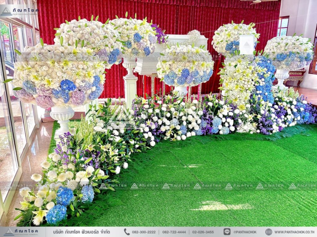 ดอกไม้หน้าศพแบบพุ่มสีฟ้าม่วง ดอกไม้งานศพแบบพุ่ม จัดงานศพสวยหรู ดอกไม้หน้าศพสีขาว จัดดอกไม้ประดับหน้าหีบศพเรียบหรู จัดสวนดอกไม้งานศพสวยๆ